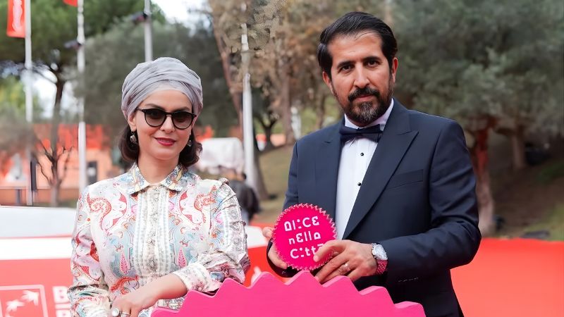 "Producer and lead actress of the film Raha on the red carpet at Italian festival Alice nella Città, holding the Best Film award"